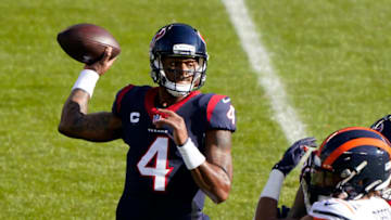 Dec 13, 2020; Chicago, Illinois, USA; Houston Texans quarterback Deshaun Watson (4) drops back to pass against the Chicago Bears during the first quarter at Soldier Field. Mandatory Credit: Mike Dinovo-USA TODAY Sports