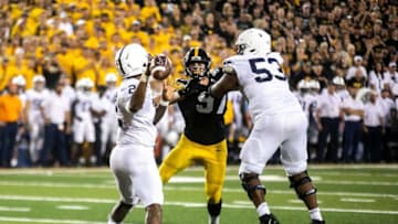 Iowa linebacker Jestin Jacobs (5) goes up against a block from Penn State offensive lineman Rasheed Walker (53) as quarterback Ta'Quan Roberson (2) looks to pass during a NCAA Big Ten Conference football game, Saturday, Oct. 9, 2021, at Kinnick Stadium in Iowa City, Iowa. Iowa beat Penn State, 23-20.211009 Penn St Iowa Fb 078 Jpg
