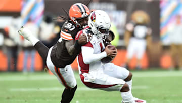 Oct 17, 2021; Cleveland, Ohio, USA; Cleveland Browns defensive end Jadeveon Clowney (90) sacks Arizona Cardinals quarterback Kyler Murray (1) during the first half at FirstEnergy Stadium. Mandatory Credit: Ken Blaze-USA TODAY Sports