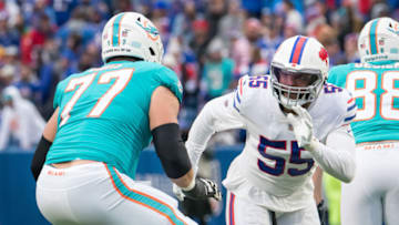 Oct 31, 2021; Orchard Park, New York, USA; Buffalo Bills defensive end Jerry Hughes (55) pass rushes against Miami Dolphins guard Jesse Davis (77) in the fourth quarter at Highmark Stadium. Mandatory Credit: Mark Konezny-USA TODAY Sports