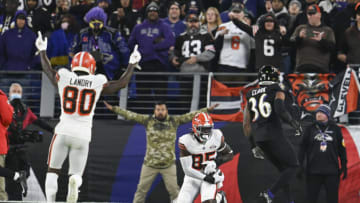 Nov 28, 2021; Baltimore, Maryland, USA; Cleveland Browns tight end David Njoku (85) catches a pass for a touchdown in front of Baltimore Ravens safety Chuck Clark (36) as C wide receiver Jarvis Landry (80) celebrates at M&T Bank Stadium. Mandatory Credit: Tommy Gilligan-USA TODAY Sports