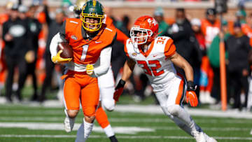 Feb 5, 2022; Mobile, AL, USA; National Squad wide receiver Christian Watson of North Dakota State (1) runs with the ball in the first half against the American squad during the Senior bowl at Hancock Whitney Stadium. Mandatory Credit: Nathan Ray Seebeck-USA TODAY Sports