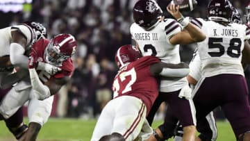 Oct 22, 2022; Tuscaloosa, Alabama, USA; Alabama Crimson Tide defensive lineman Byron Young (47) hits Mississippi State Bulldogs quarterback Will Rogers (2) to force an incomplete pass at Bryant-Denny Stadium. Alabama won 30-6. Mandatory Credit: Gary Cosby Jr.-USA TODAY Sports