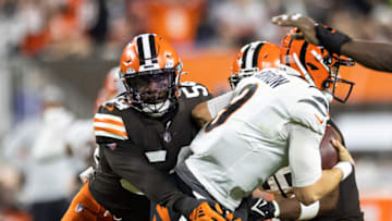 Oct 31, 2022; Cleveland, Ohio, USA; Cleveland Browns linebacker Deion Jones (54) sacks Cincinnati Bengals quarterback Joe Burrow (9) during the third quarter at FirstEnergy Stadium. Mandatory Credit: Scott Galvin-USA TODAY Sports