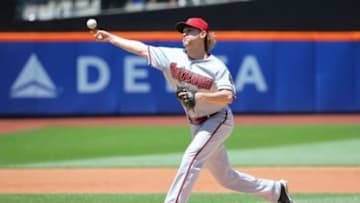 May 25, 2014; New York, NY, USA; Arizona Diamondbacks starting pitcher Bronson Arroyo (61) pitches during the first inning against the New York Mets at Citi Field. Mandatory Credit: Anthony Gruppuso-USA TODAY Sports