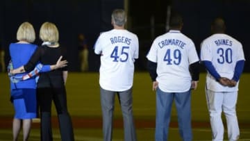 Mar 28, 2014; Montreal, Quebec, CAN; Gary Carter's wife and daughter embrace next to former Expos Steve rogers and Warren Cromartie and Tim Raines during a tribute to him prior to the game between the Toronto Blue Jays and the New York Mets at the Olympic Stadium. Mandatory Credit: Eric Bolte-USA TODAY Sports