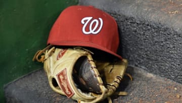 Apr 26, 2016; Washington, DC, USA; A general view of a Washington Nationals hat and glove in the dugout during the third inning against the Philadelphia Phillies at Nationals Park. Mandatory Credit: Tommy Gilligan-USA TODAY Sports