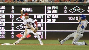 Jun 27, 2016; Washington, DC, USA; Washington Nationals shortstop Danny Espinosa (8) throws to first after the force out New York Mets third baseman Wilmer Flores (4) during the eighth inning at Nationals Park. Washington Nationals defeated New York Mets 11-4. Mandatory Credit: Tommy Gilligan-USA TODAY Sports