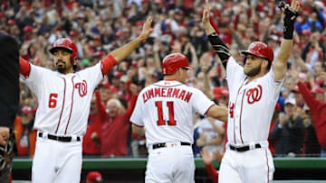 Apr 7, 2016; Washington, DC, USA; Washington Nationals second baseman Anthony Rendon (6) and right fielder Bryce Harper (34) celebrate after scoring against the Miami Marlins during the first inning at Nationals Park. Mandatory Credit: Brad Mills-USA TODAY Sports