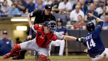 MILWAUKEE, WI - JULY 23: Matt Wieters #32 of the Washington Nationals tags out Hernan Perez #14 of the Milwaukee Brewers at home plate in the fourth inning at Miller Park on July 23, 2018 in Milwaukee, Wisconsin. (Photo by Dylan Buell/Getty Images)