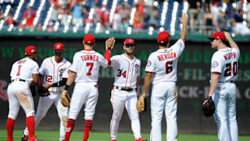 WASHINGTON, DC - AUGUST 05: Bryce Harper #34 of the Washington Nationals celebrates with teammates after a 2-1 victory against the Cincinnati Reds at Nationals Park on August 5, 2018 in Washington, DC. (Photo by Greg Fiume/Getty Images)