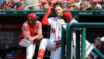 WASHINGTON, DC - AUGUST 05: Bryce Harper #34 of the Washington Nationals talks with hitting coach Kevin Long #54 and manager Dave Martinez #4 during a pitching change in the eighth inning against the Cincinnati Reds at Nationals Park on August 5, 2018 in Washington, DC. (Photo by Greg Fiume/Getty Images)