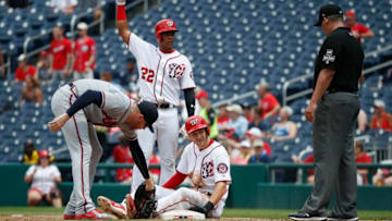 WASHINGTON, DC - AUGUST 07: Trea Turner #7 of the Washington Nationals is safe at first base against Freddie Freeman #5 of the Atlanta Braves after a single by Juan Soto #22 in the third inning at Nationals Park on August 7, 2018 in Washington, DC. Soto was called out at first base for passing Turner on the bases. (Photo by Patrick McDermott/Getty Images)