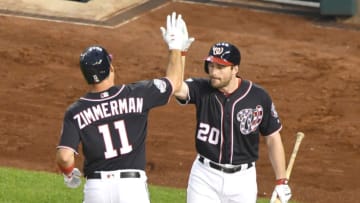 WASHINGTON, DC - AUGUST 17: Ryan Zimmerman #11 of the Washington Nationals celebrates hitting a solo home run in the second inning with Daniel Murphy #20 during a baseball game the Miami Marlins at Nationals Park on August 17, 2018 in Washington, DC. (Photo by Mitchell Layton/Getty Images)