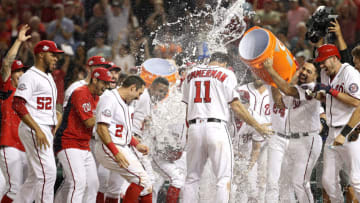 WASHINGTON, DC - AUGUST 22: Ryan Zimmerman #11 of the Washington Nationals celebrates with teammates after hitting a walk-off two-run home run against the Philadelphia Phillies during the ninth inning at Nationals Park on August 22, 2018 in Washington, DC. (Photo by Patrick Smith/Getty Images)