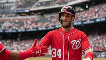 ATLANTA, GA - SEPTEMBER 16: Bryce Harper #34 of the Washington Nationals is greeted with high fives by teammates after hitting a two run home run in the first inning agains the Atlanta Braves at SunTrust Park on September 16, 2018 in Atlanta, Georgia.(Photo by Kelly Kline/Getty Images)