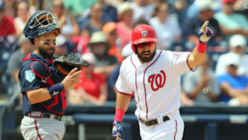 WEST PALM BEACH, FL - MARCH 13: Adam Eaton #2 of the Washington Nationals gestures as he passes catcher Raffy Lopez #55 of the Atlanta Braves after hitting a home run in the second inning of a spring training baseball game at Fitteam Ballpark of the Palm Beaches on March 13, 2019 in West Palm Beach, Florida. The Nationals defeated the Braves 8-4. (Photo by Rich Schultz/Getty Images)