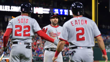 PHILADELPHIA, PA - APRIL 10: Brian Dozier #9 of the Washington Nationals crosses home plate and is greeted by teammates Juan Soto #22 and Adam Eaton #2 in the fourth inning against the Philadelphia Phillies at Citizens Bank Park on April 10, 2019 in Philadelphia, Pennsylvania. (Photo by Drew Hallowell/Getty Images)