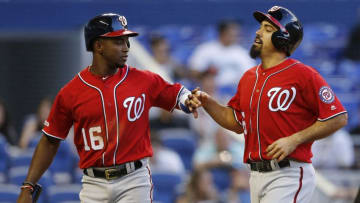 MIAMI, FLORIDA - APRIL 20: Anthony Rendon #6 of the Washington Nationals celebrates with Victor Robles #16 after scoring in the third inning against the Miami Marlins at Marlins Park on April 20, 2019 in Miami, Florida. (Photo by Michael Reaves/Getty Images)