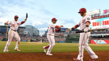 WASHINGTON, DC - JULY 03: Brian Dozier #9 of the Washington Nationals celebrates with Yan Gomes #10 and Juan Soto #22 after hitting a two-run home run in the sixth inning against the Miami Marlins at Nationals Park on July 3, 2019 in Washington, DC. (Photo by Greg Fiume/Getty Images)