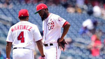 WASHINGTON, DC - JULY 04: Wander Suero #51 of the Washington Nationals reacts as manager Dave Martinez #4 walks to the pitchers mound to remove him from the game in the eighth inning against the Miami Marlins at Nationals Park on July 4, 2019 in Washington, DC. (Photo by Patrick McDermott/Getty Images)