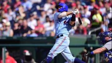 WASHINGTON, DC - JULY 06: Kurt Suzuki #28 of the Washington Nationals hits a two-run home run in the second inning against the Kansas City Royals at Nationals Park on July 6, 2019 in Washington, DC. The Nationals are paying tribute to the Montreal Expos by wearing retro jerseys. (Photo by Patrick McDermott/Getty Images)