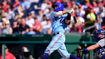 WASHINGTON, DC - JULY 06: Kurt Suzuki #28 of the Washington Nationals hits a two-run home run in the second inning against the Kansas City Royals at Nationals Park on July 6, 2019 in Washington, DC. The Nationals are paying tribute to the Montreal Expos by wearing retro jerseys. (Photo by Patrick McDermott/Getty Images)