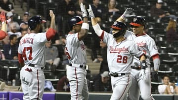 CHICAGO, ILLINOIS - JUNE 10: Kurt Suzuki #28 of the Washington Nationals is greeted after hitting a grand slam home run against the Chicago White Sox during the ninth inning at Guaranteed Rate Field on June 10, 2019 in Chicago, Illinois. (Photo by David Banks/Getty Images)