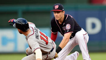 WASHINGTON, DC - JULY 30: Ender Inciarte #11 of the Atlanta Braves is safe at second base against Trea Turner #7 of the Washington Nationals on a pickoff attempt in the second inning at Nationals Park on July 30, 2019 in Washington, DC. (Photo by Patrick McDermott/Getty Images)