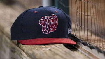 AUGUST 16: A Washington Nationals hat sits on the dugout wall during the eighth inning of the game between the Washington Nationals and the Milwaukee Brewers at Nationals Park on August 16, 2019 in Washington, DC. (Photo by Scott Taetsch/Getty Images)
