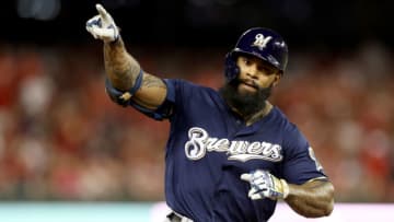 WASHINGTON, DC - OCTOBER 01: Eric Thames #7 of the Milwaukee Brewers celebrates after scoring a home run against Max Scherzer #31 of the Washington Nationals during the second inning in the National League Wild Card game at Nationals Park on October 01, 2019 in Washington, DC. (Photo by Rob Carr/Getty Images)