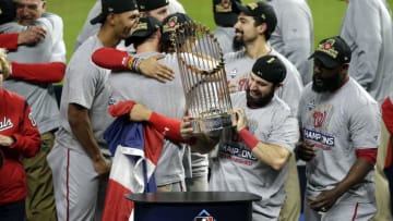 HOUSTON, TEXAS - OCTOBER 30: Adam Eaton #2 of the Washington Nationals holds the Commissioners Trophy after defeating the Houston Astros 6-2 in Game Seven to win the 2019 World Series in Game Seven of the 2019 World Series at Minute Maid Park on October 30, 2019 in Houston, Texas. (Photo by Bob Levey/Getty Images)