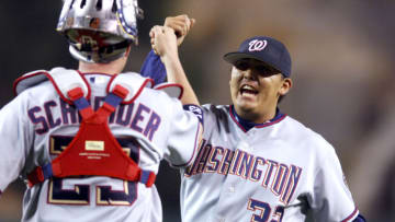 Washington pitcher Chad Cordero is congratulated by catcher Brian Schneider after striking out Los Angeles third baseman Dallas McPherson for the final out with the bases loaded. The Washington Nationals defeated the Los Angeles Angels of Anaheim 1-0 at Angel Stadium in Anaheim, California, on June 15, 2005. (Photo by Kirby Lee/Getty Images)