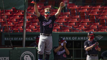 Brock Holt #42 of the Washington Nationals, a former member of the Boston Red Sox, reacts as a tribute video is played on the video board during a game on August 30, 2020 at Fenway Park in Boston, Massachusetts. The 2020 season had been postponed since March due to the COVID-19 pandemic. (Photo by Billie Weiss/Boston Red Sox/Getty Images)