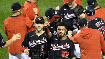 Luis Garcia #62 and Trea Turner #7 of the Washington Nationals celebrate with teammates after a 5-3 victory against the New York Mets in game 2 of a double header at Nationals Park on September 26, 2020 in Washington, DC. (Photo by Greg Fiume/Getty Images)