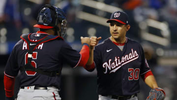 Paolo Espino #30 of the Washington Nationals celebrates with Alex Avila #6 of the Washington Nationals after defeating the New York Mets 7-1 at Citi Field on April 24, 2021 in the Flushing neighborhood of the Queens borough of New York City. (Photo by Adam Hunger/Getty Images)