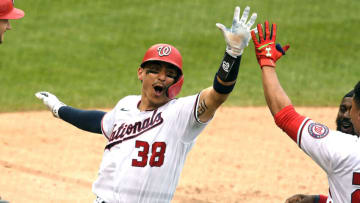 Tres Barrera #38 of the Washington Nationals celebrates scoring the winning run on in the ninth inning on Alcides Escobar #3 hit in the ninth inning s baseball game against the San Diego Padres at Nationals Park on July 18, 2021 in Washington, DC. (Photo by Mitchell Layton/Getty Images)