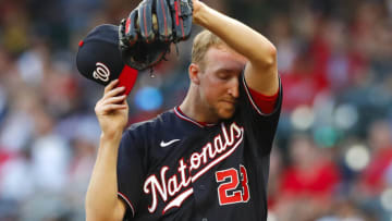 Erick Fedde #23 of the Washington Nationals reacts in the first inning of an MLB game against the Atlanta Braves at Truist Park on August 6, 2021 in Atlanta, Georgia. (Photo by Todd Kirkland/Getty Images)