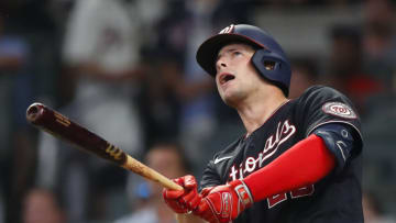 Riley Adams #25 of the Washington Nationals hits a go-ahead two-run home run in the ninth inning of an MLB game against the Atlanta Braves at Truist Park on August 7, 2021 in Atlanta, Georgia. (Photo by Todd Kirkland/Getty Images)