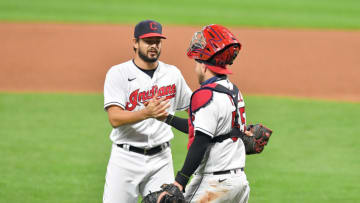 Closing pitcher Brad Hand #33 celebrates with catcher Roberto Perez #55 of the Cleveland Indians after the Indians defeated the Kansas City Royals at Progressive Field on September 07, 2020 in Cleveland, Ohio. The Indians defeated the Royals 5-2. (Photo by Jason Miller/Getty Images)