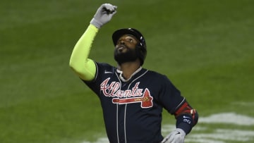 NEW YORK, NEW YORK - SEPTEMBER 18: Marcell Ozuna #20 of the Atlanta Braves reacts after hitting a home run during the second inning against the New York Mets at Citi Field on September 18, 2020 in the Queens borough of New York City. (Photo by Sarah Stier/Getty Images)