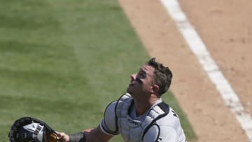 James McCann #33 of the Chicago White Sox tracks a foul pop-up against the Oakland Athletics during the seventh inning of the Wild Card Round Game One at RingCentral Coliseum on September 29, 2020 in Oakland, California. (Photo by Thearon W. Henderson/Getty Images)