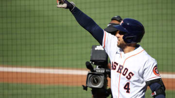 George Springer #4 of the Houston Astros points to third base coach Gary Pettis in the box after hitting a solo home run against John Curtiss #84 of the Tampa Bay Rays during the first inning in Game Five of the American League Championship Series at PETCO Park on October 15, 2020 in San Diego, California. (Photo by Sean M. Haffey/Getty Images)