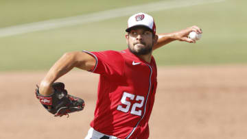 Brad Hand #52 of the Washington Nationals delivers a pitch against the Miami Marlins during the sixth inning of a Grapefruit League spring training game at Roger Dean Chevrolet Stadium on March 11, 2021 in Jupiter, Florida. (Photo by Michael Reaves/Getty Images)