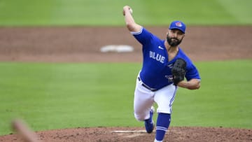 Tanner Roark #14 of the Toronto Blue Jays throws a pitch during the third inning against the New York Yankees during a spring training game at TD Ballpark on March 21, 2021 in Dunedin, Florida. (Photo by Douglas P. DeFelice/Getty Images)
