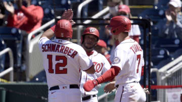 Kyle Schwarber #12, Trea Turner #7 and Yadiel Hernandez #29 of the Washington Nationals celebrate after scoring in the fourth inning against the Miami Marlins at Nationals Park on May 01, 2021 in Washington, DC. (Photo by Greg Fiume/Getty Images)