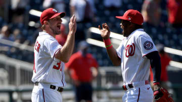 Max Scherzer #31 of the Washington Nationals celebrates with Victor Robles #16 after throwing a complete game against the Miami Marlins at Nationals Park on May 02, 2021 in Washington, DC. (Photo by Will Newton/Getty Images)
