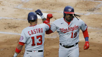 Josh Bell #19 high-fives Starlin Castro #13 of the Washington Nationals after his home run during the second inning against the New York Yankees at Yankee Stadium on May 07, 2021 in the Bronx borough of New York City. (Photo by Sarah Stier/Getty Images)