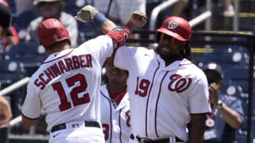 WASHINGTON, DC - MAY 23: Kyle Schwarber #12 of the Washington Nationals celebrates with Josh Bell #19 after hitting a two-run home run in the first inning against the Baltimore Orioles at Nationals Park on May 23, 2021 in Washington, DC. (Photo by Greg Fiume/Getty Images)