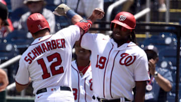 WASHINGTON, DC - MAY 23: Kyle Schwarber #12 of the Washington Nationals celebrates with Josh Bell #19 after hitting a two-run home run in the first inning against the Baltimore Orioles at Nationals Park on May 23, 2021 in Washington, DC. (Photo by Greg Fiume/Getty Images)